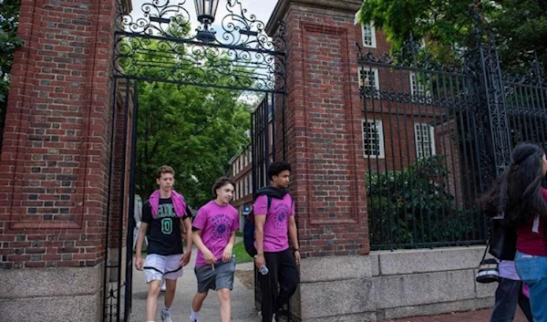 Students exit Harvard Yard in Cambridge, Massachusetts. (AFP)