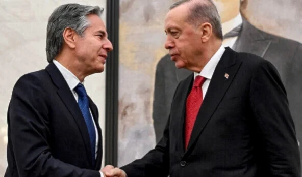 US Secretary of State Antony Blinken, left, shakes hands with Turkey's President Recep Tayyip Erodgan, during their meeting at Ankara Esenboga Airport on December 12, 2024. (AP)