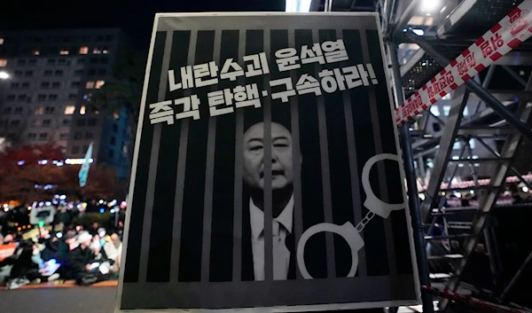 An image of depicting an imprisoned South Korean President Yoon Suk Yeol is displayed during a rally to demand his impeachment outside the National Assembly in Seoul, South Korea, on December 13, 2024. (AP)