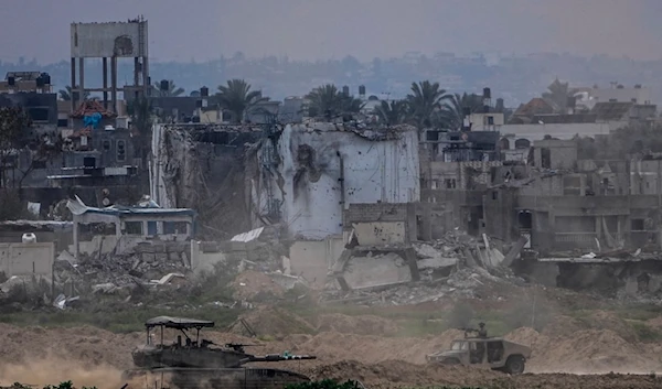 Israeli occupation soldiers operate inside the Gaza Strip, as seen from southern occupied Palestine, Feb. 13, 2024. (AP)