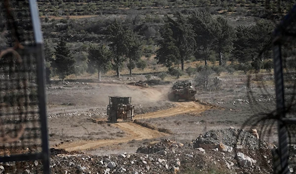 Israeli armoured vehicles cross the security fence moving towards the so-called Alpha Line that separates the Israeli-controlled Golan Heights from Syria, in the town of Majdal Shams, Friday, Dec. 13, 2024. (AP