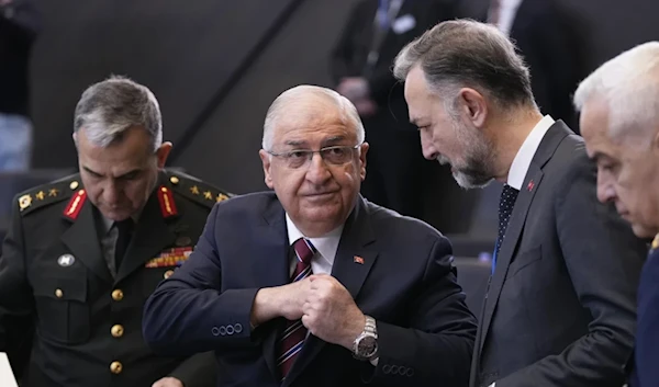 Turkish Defense Minister Yasar Guler, second left, speaks with members of his delegation during a meeting at Nato headquaters in Brussels, Thursday, Feburary 15,2024. (AP)