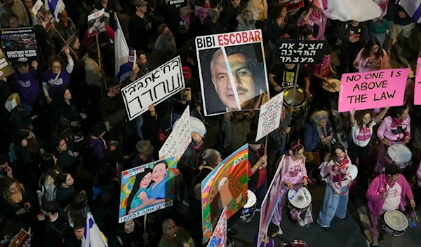 Israelis protest against Prime Minister Benjamin Netanyahu's government and call for the release of captives held in the Gaza Strip by Hamas, in Tel Aviv, occupied Palestine, Saturday, December 14, 2024 (AP)