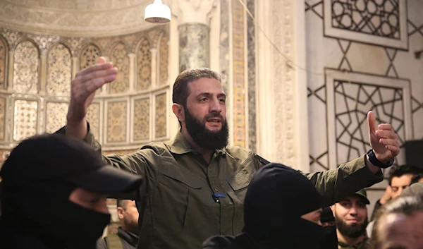 Ahmad Al-Sharaa addresses a crowd at the Syrian capital's landmark Umayyad Mosque on December 8, 2024. (AFP)