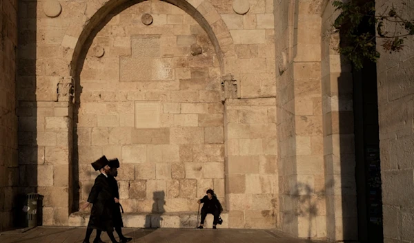 Ultra-Orthodox Jewish men approach Bab al-Khalil in occupied Al-Quds, shortly before Shabbat, the day of rest, Friday, Nov. 22, 2024. (AP Photo/Maya Alleruzzo)