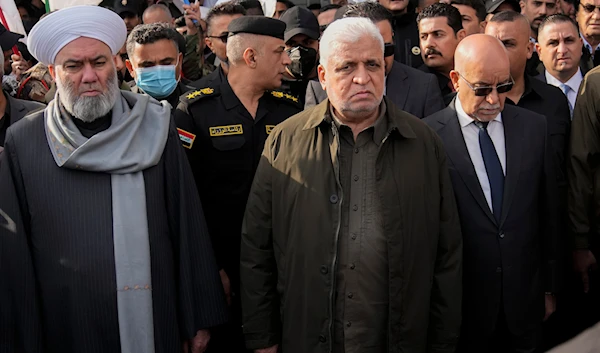 The head of Iraq's Popular Mobilisation Front, Faleh al-Fayyad, center, attends a funeral for the group members who were killed by a US air strike, in Baghdad, Iraq, Feb. 4, 2024. (AP)