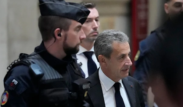 Former French President Nicolas Sarkozy arrives at the courtroom for his appeal trial, Monday, Dec. 5, 2022 in Paris. (AP)