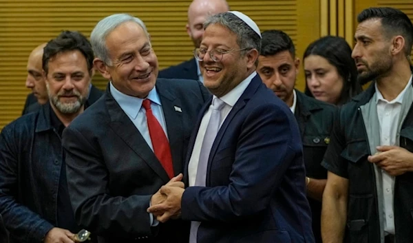 Israeli occupation Prime Minister Benjamin Netanyahu and police minister Itamar Ben-Gvir in the Knesset in occupied al-Quds, May 23,2023. (AP)