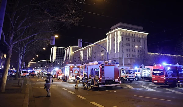 Police and ambulances next to a Christmas market where a car crashed into a crowd, injuring dozens, according to a spokesman for the local rescue service, on December 20, 2024 in Magdeburg, eastern Germany ( AFP)