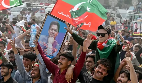 Pakistan Tehreek-e-Insaf party activists take part in a public rally on the outskirts of Lahore, Pakistan, on Sept. 21, 2024. (AFP via Getty Images)