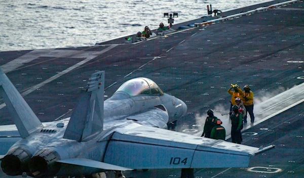 In this photograph released by the U.S. Navy, an F/A-18 Super Hornet prepares to launch off the flight deck of the Nimitz-class aircraft carrier USS Theodore Roosevelt July 5, 2024, in the South China Sea. (AP)