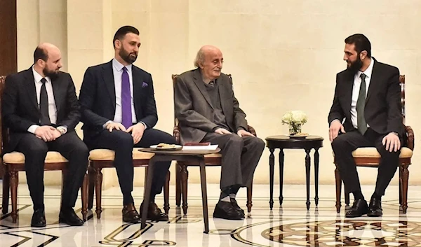 Walid Jumblatt and his son and current party head Taymur Jumblatt meet with Syrian leader Ahmed al-Sharaa and interim prime minister Mohammad al-Bashir during a visit to Damascus on December 22, 2024. (AFP)