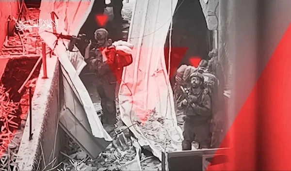 A screengrab from a video by al-Qassam brigades showing its freedom fighers monitori Israeli occupation forces invading the Gaza Strip during the genocidal war against the Gaza Strip, Palestine. (Military media)