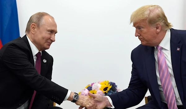 n this June 28, 2019, file photo, President Donald Trump, right, shakes hands with Russian President Vladimir Putin, left, during a bilateral meeting on the sidelines of the G-20 summit in Osaka, Japan. (AP0