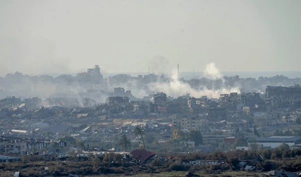 Smoke rises following an explosion in the Gaza Strip as seen from southern Palestine, Wednesday, Dec. 18, 2024. (AP Photo/Ohad Zwigenberg)