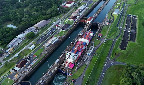 FILE - A cargo ship traverses the Agua Clara Locks of the Panama Canal in Colon, Panama, Sept. 2, 2024. (AP Photo/Matias Delacroix, File)