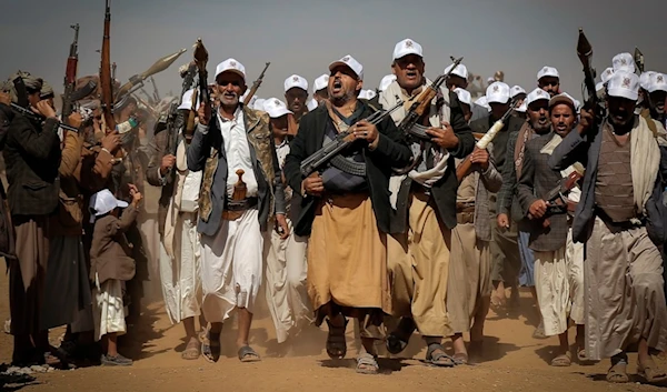 Ansar Allah fighters march during a rally of support for the Palestinians in the Gaza Strip and against the US strikes on Yemen outside Sanaa on Monday, January 22, 2024 (AP)