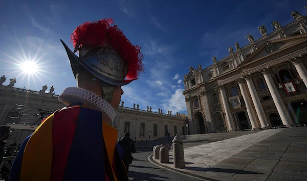 A Vatican Swiss Guard watches over St. Peter's Basilica at the Vatican, on December 25, 2024. (AP)