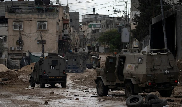 A convoy of Israeli military armored vehicles is seen during a military raid in the Tulkarem refugee camp near the West Bank city of Tulkarm, occupied Palestine , Dec. 24, 2024. (AP)