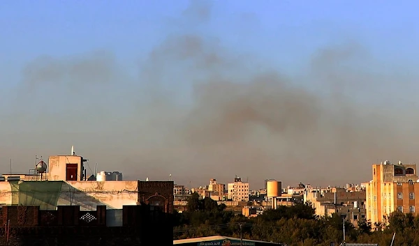 Smoke rises from the area around the International Airport following an airstrike, as seen from Sanaa, Yemen, Thursday, Dec. 26, 2024. (AP)