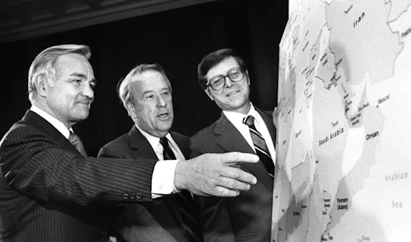 CIA Director Stansfield Turner, shows Sen. Henry Jackson, chairman of the Senate Committee on Energy, and Sen. Pete Domenici, the main areas of oil supply in the ME, April 22, 1980, Wash, US. (AP)