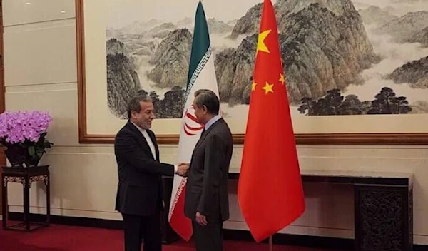 Iranian foreign minister Abbas Araghchi shakes the hand of his Chinese counterpart, Wang Yi, ahead of their meeting in Beijing, China, December 28, 2024 (IRNA)