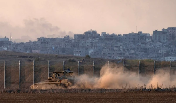 Israeli soldiers move on armored personnel carriers (APC) near the separation line with Gaza, occupied Palestine, Wednesday, Dec.18, 2024. (AP Photo/Ohad Zwigenberg)