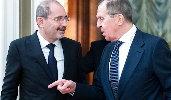 Russian Foreign Minister Sergey Lavrov, right, and Jordanian counterpart Ayman Safadi enter the hall during their meeting in Moscow, Russia, Wednesday, Feb. 19, 2020. (AP)