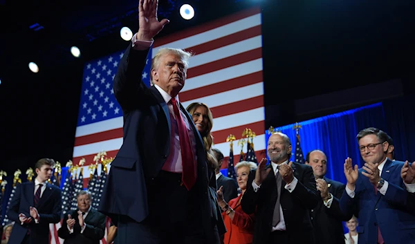 Republican presidential nominee former President Donald Trump and former first lady Melania Trump walk on stage at an election night watch party at the Palm Beach Convention Center, on November 6, 2024, in West Palm Beach, Fla. (AP)