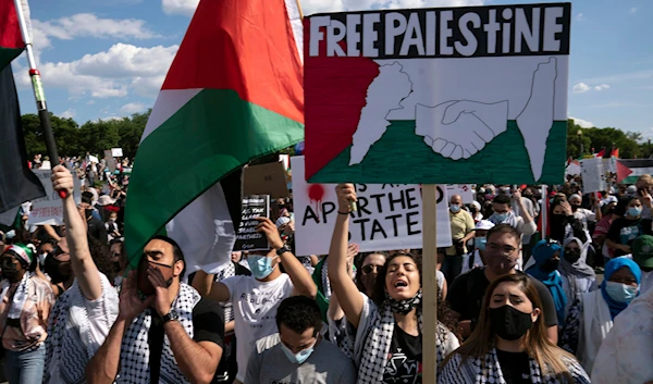 Activists supporting Palestine chants as they gather at the Washington Monument during a demonstration in Washington, on May 15. 2021. (AP)