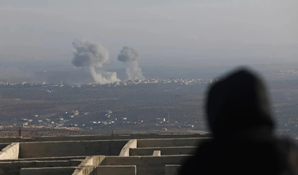 Smoke rises amid fighting between opposition factions and Syrian goverment troops in Idlib, Syria on November 28,2024. (AP)