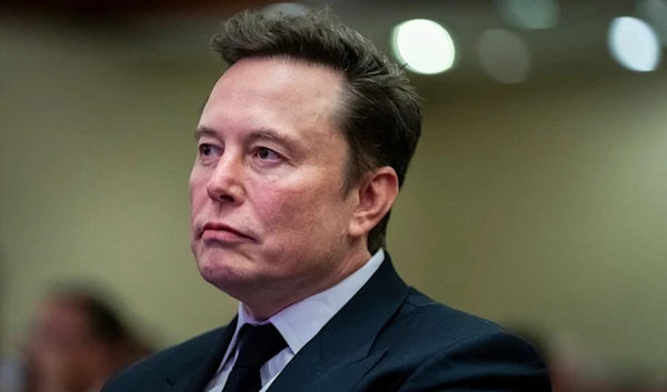 Elon Musk listens as President-elect Donald Trump speaks during a meeting with the House GOP conference, Wednesday, Nov. 13, 2024, in Washington. (AP)