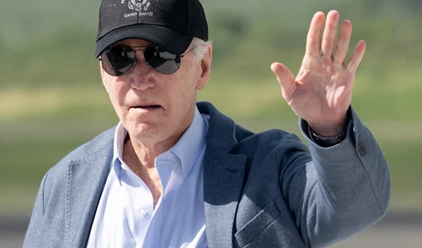 Joe Biden arrives at the airport in Christiansted, St Croix, on the US Virgin Islands, on 26 December. (AFP/Getty Images)