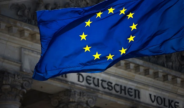 A European flag waves in front of the Reichstag building with the inscription 'Dem deutschen Volke' ('To The German People') in Berlin, Germany, Thursday, Aug. 23, 2012. (AP)