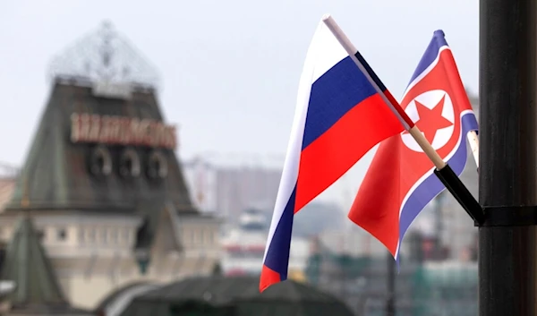 Flags of Russia and North Korea are seen in front of the central railway station in Vladivostok, Russia, Wednesday, April 24, 2019. (AP)