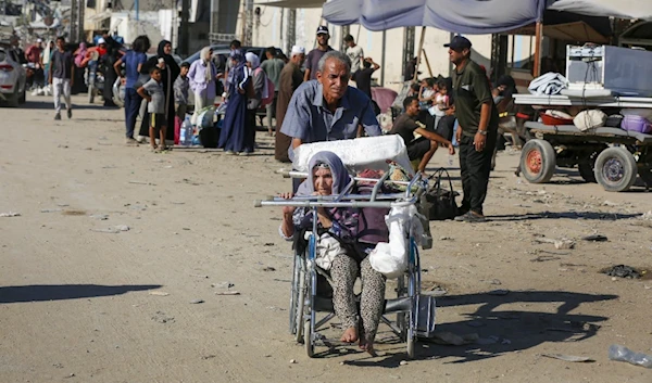 WHO estimates that one in four people  sustained life-changing injuries & will need rehabilitation services, including care for amputations & spinal cords injuries.  A Palestinain man pulls a women injured during the Israeli war on Gaza. (UNRWA)