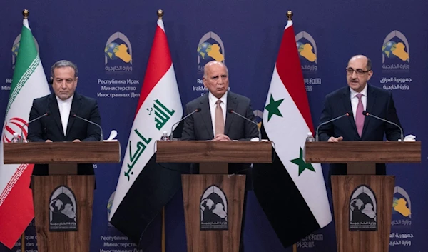 Iraqi Foreign Minister Fouad Hussein, center, Iranian Foreign Minister Abbas Araghchi, left, and Syrian Foreign Minister Bassam Sabbagh, right, hold a press conference in Baghdad, Iraq, Dec. 6, 2024. (AP)