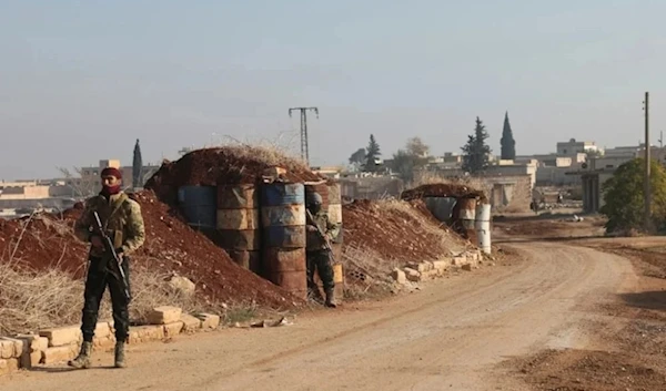 A militant stands guard in Kafr Halab, Aleppo countryside, Syria, on November 29,2024. (AP)