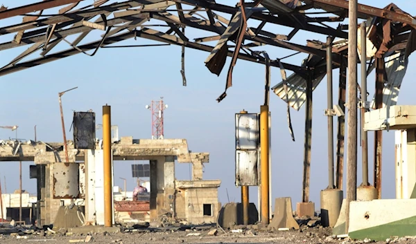 The destroyed crossing border point between Lebanon and Syria which hit by an Israeli airstrike is shown, in Arida, north Lebanon, Friday, Dec. 6, 2024. (AP Photo)