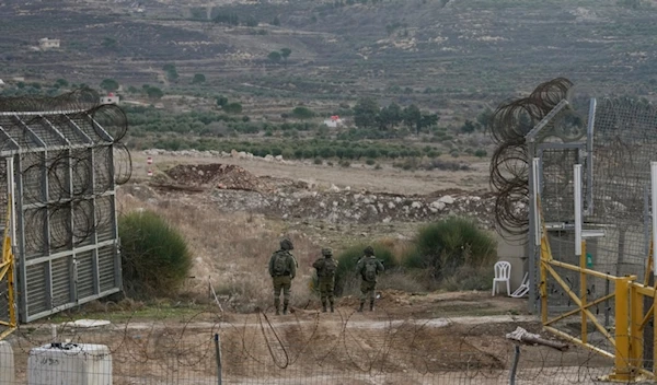 Israeli occupation forces slong a security fence gate near the so-called Alpha Line in the Israeli-occupied Syrian Golan Height, in the town of Majdal Shams, Monday, Dec. 9, 2024. (AP)