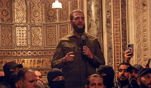 Abu Mohammed al-Golani speaks at the Umayyad Mosque in Damascus on December 8, 2024. (AP)