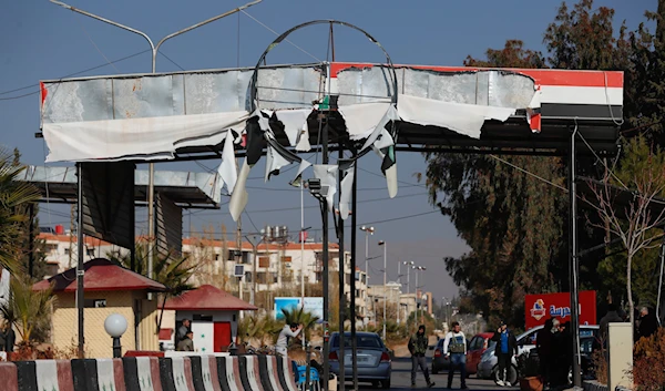 Syrian opposition fighters man a checkpoint in Damascus, Syria, on December 9, 2024. (AP)