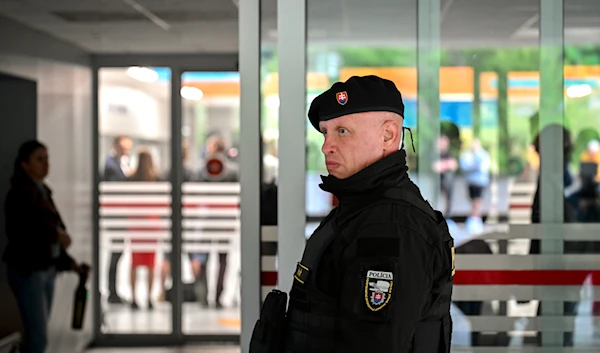 A policeman monitors the entrance of the F. D. Roosevelt University Hospital, where Slovak Prime Minister Robert Fico, who was shot and injured, is treated in Banska Bystrica, central Slovakia, Wednesday, May 15, 2024. (AP)