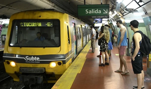 Passengers wait to enter a subway car in Buenos Aires on March 31, 2016. (AFP)