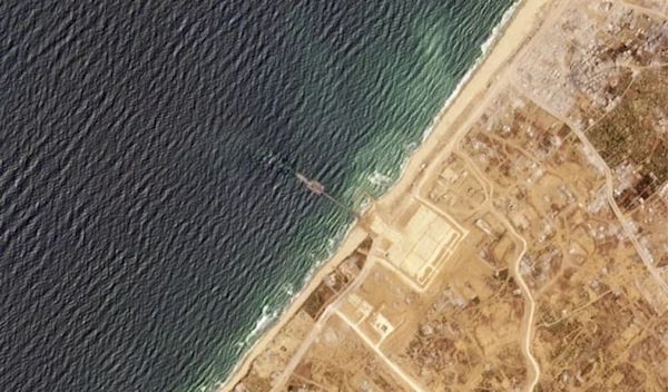 This satellite image from Planet Labs PBC shows a pier installed by the U.S. military in the Gaza Strip on Thursday, May 16, 2024. (Planet Labs PBC via AP)