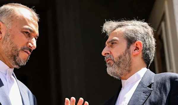 Then Foreign Minister Hossein Amir-Abdollahian and Acting Foreign Minister Ali Bagheri Kani confer before a meeting with the Russian foreign minister at the Iranian foreign ministry headquarters in Tehran on June 23. (AFP)