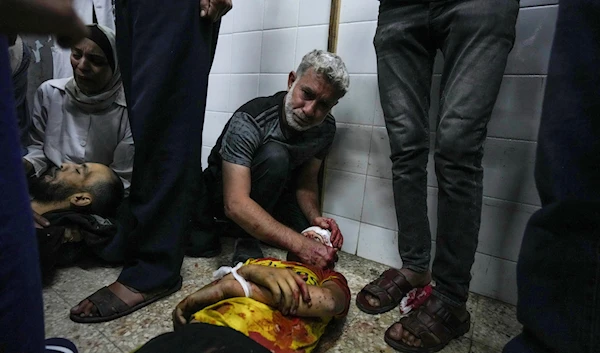 Palestinians mourn their relatives killed in the Israeli bombardment of the Gaza Strip, at the al-Aqsa hospital in Deir al-Balah, Gaza, Thursday, May 9, 2024.(AP