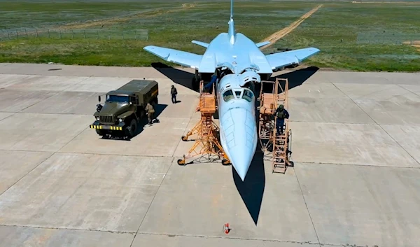 In this photo released by Russian Defense Ministry Press Service on Tuesday, May 21, 2024, Russian air force crew work to prepare a Tu-22M3 bomber for a training mission as part of drills to train the military for using tactical nuclear weapons (AP)