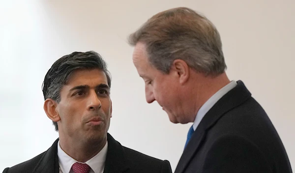 Britain's Prime Minister Rishi Sunak, left speaks with David Cameron at Horse Guards parade in London, Tuesday, Nov. 21, 2023. (AP)