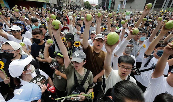 Supporters of opposition Taiwan People's Party (TPP) during a march to protest against Lai Ching-te's ruling Democratic Progressive party in Taipei, Taiwan, Sunday, May 19, 2024. (AP)